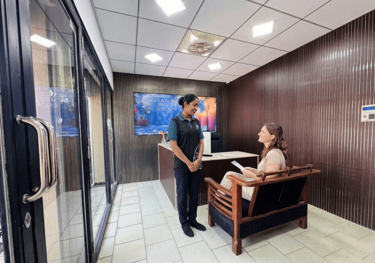 Therapist welcoming and consulting a guest at reception
